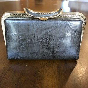 Gray leather clutch with gold details